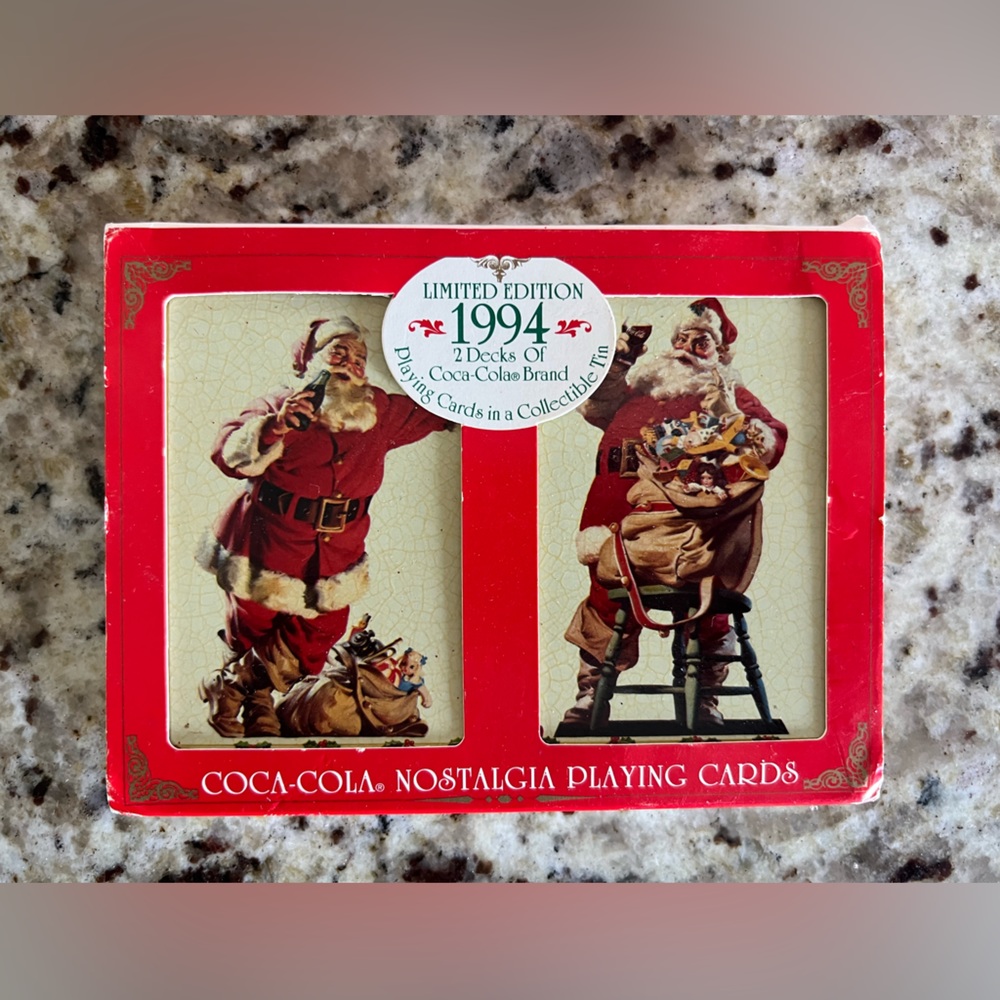New in original packaging vintage set of two Coca Cola playing cards in tin.